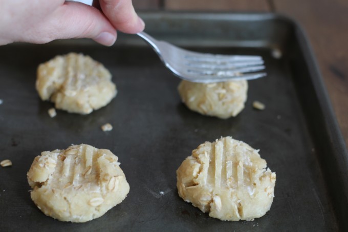 Pressing Anzac Cookies into shape